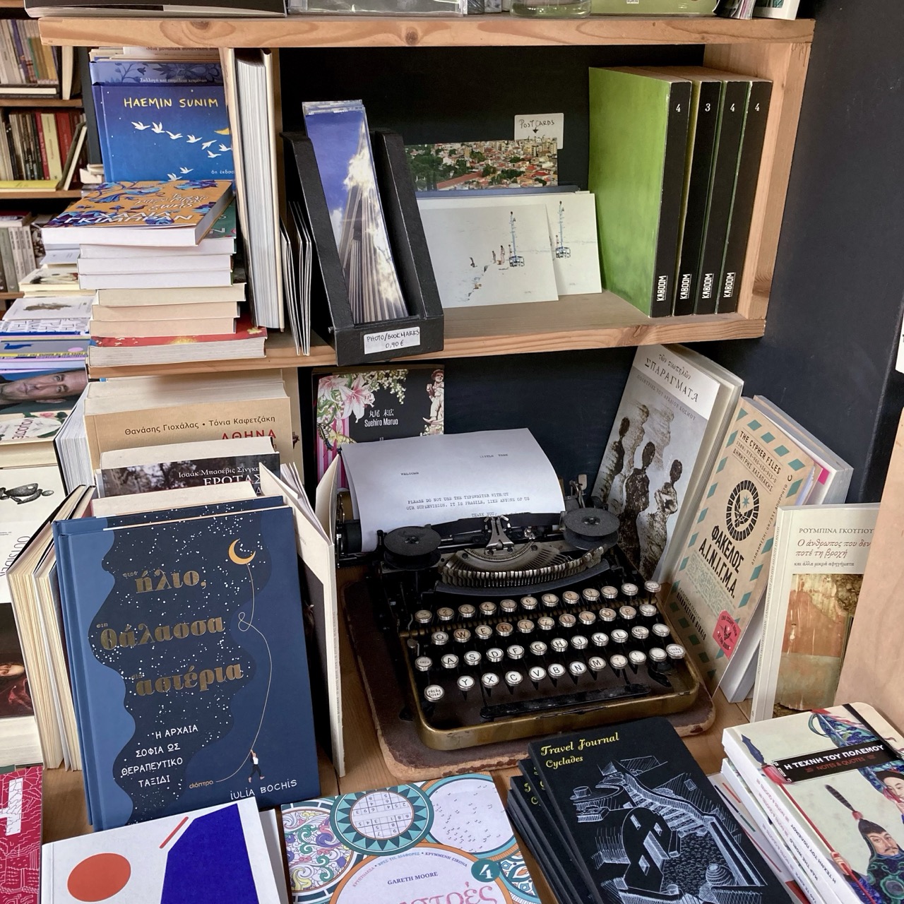 A vintage typewriter, books, and other objects at Little Tree Books and Coffee in Athens, Greece.