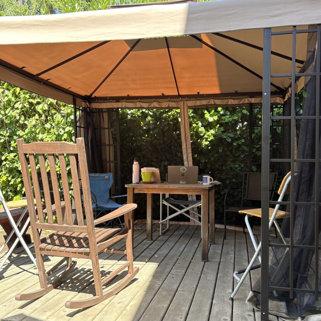One covered gathering area on the back deck of The Farmhouse.